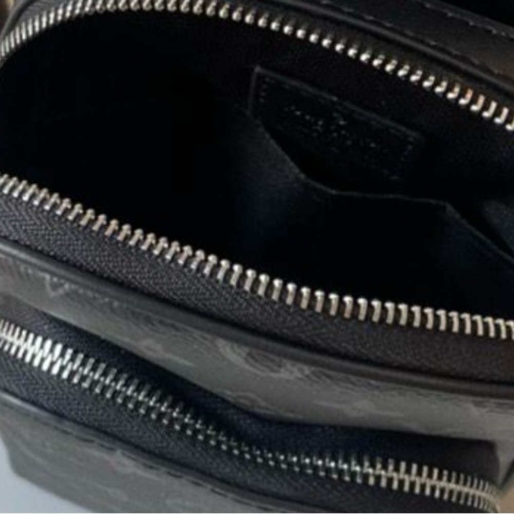 Black Leather Zippered Bag label